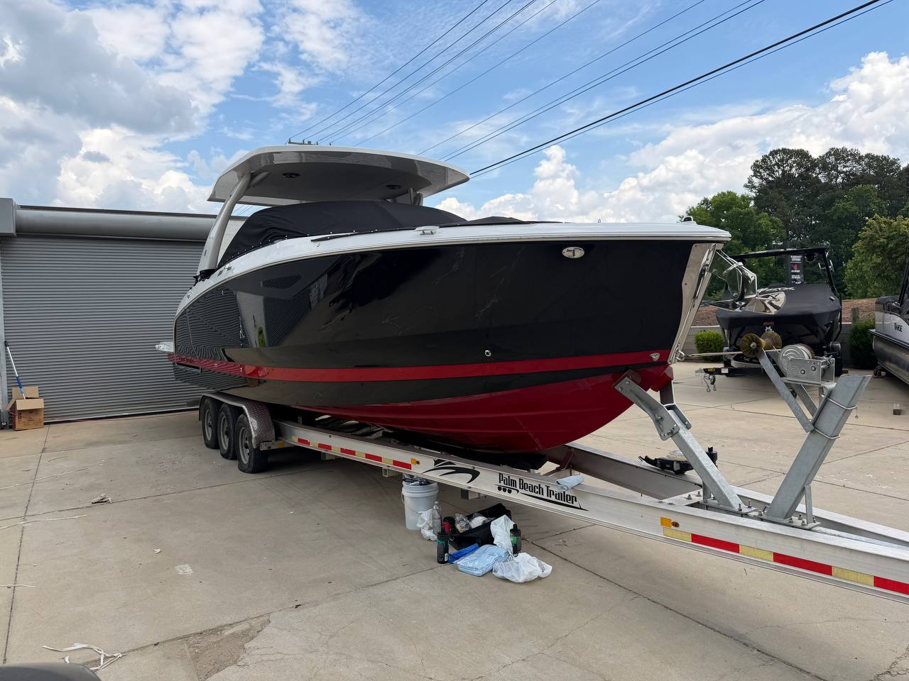 Black and red center console boat at Prime's Auto Service