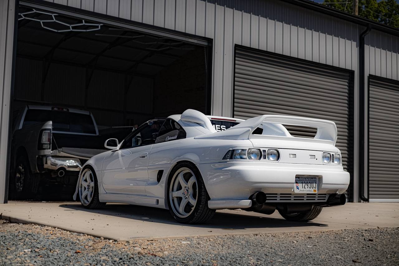 MR2 coming out of shop bay